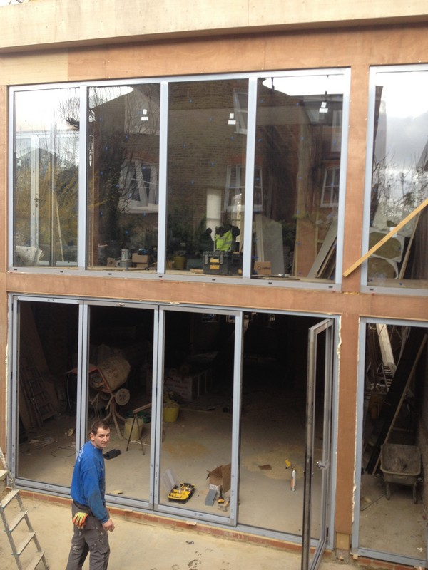 Aluminium bi-fold doors with two-storey glazing in Waterloo