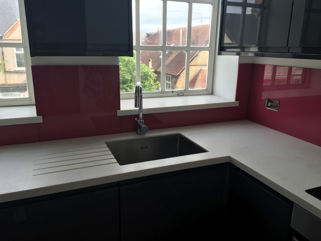 Deep plum coloured glass splashback in modern Waterloo kitchen